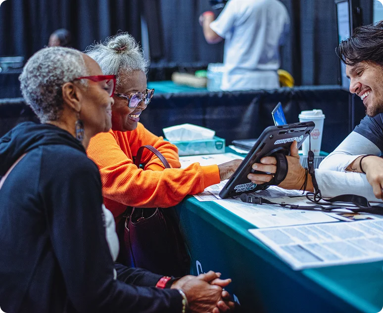 Old person reading a book to a little girl
